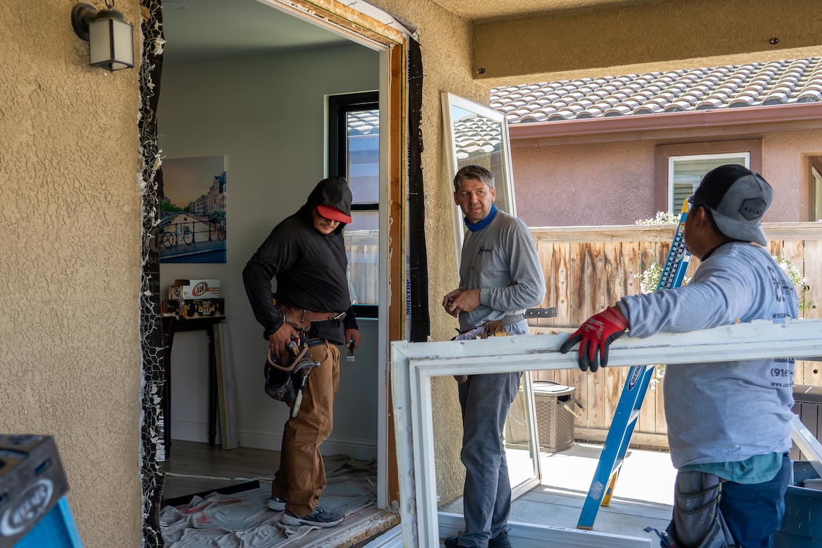 Crew installing patio door